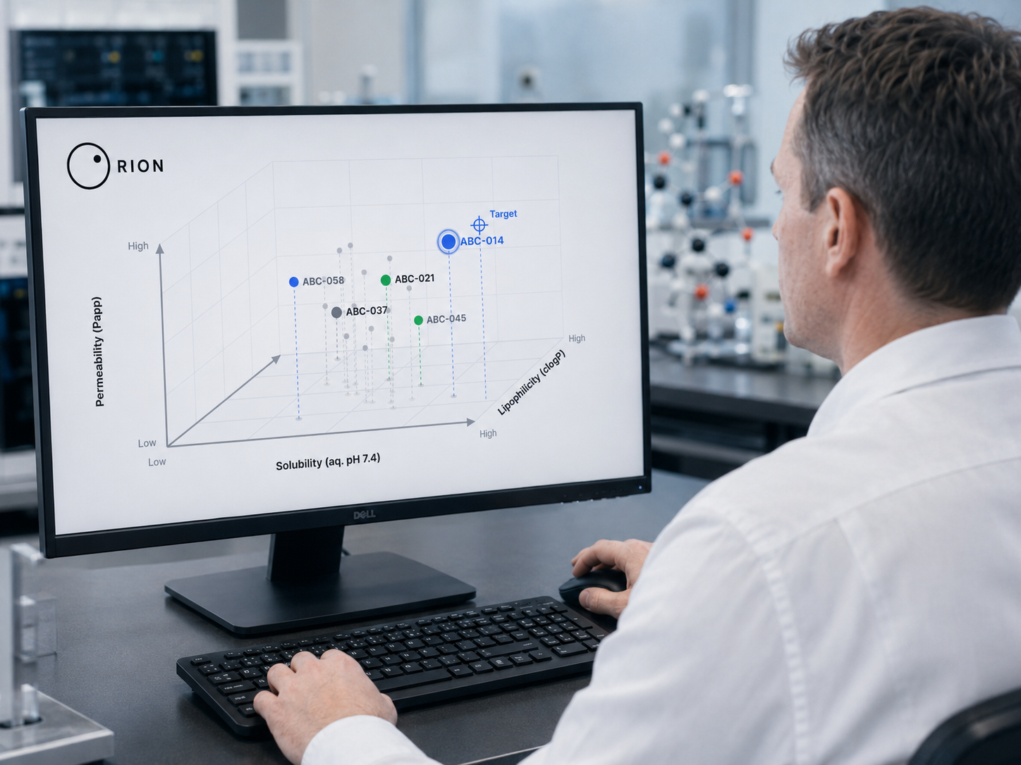 A scientist at a lab workstation reviewing a Rion three-dimensional molecular property tradeoff map on screen, plotting candidate compounds across solubility, permeability, and lipophilicity